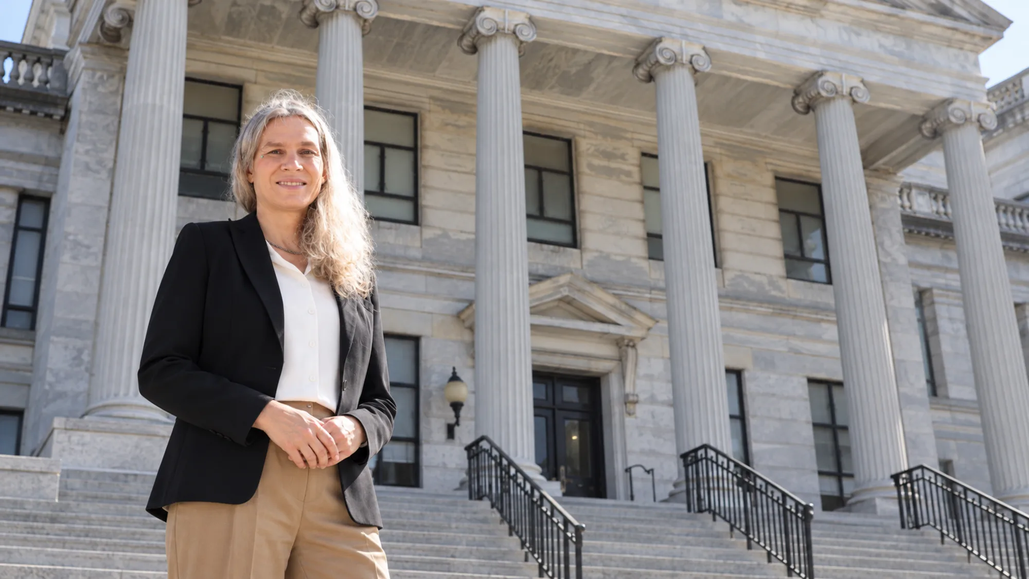 Sophia Zoë Kilmer in front of the courthouse columns